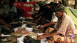Group of indigenous community preparing food