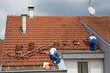 Two men working on the roof