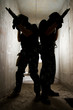 Silhouette of soldiers with guns