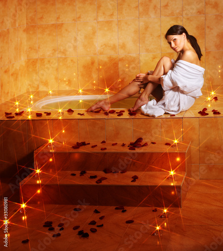 Photo: Woman relaxing in bath. Woman relaxing in bath.