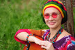 Beautiful young woman wearing rastafarian hat