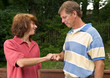 Photo: Father and teen son fist-bumping Father and teen son fist-bumping