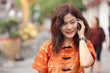 asian woman phoning
