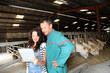 Couple of farmers using electronic tablet Couple of farmers using electronic tablet