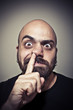 man with his finger in the nose