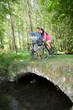 Couple riding bike in countryside