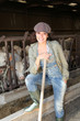 Portrait of smiling farmer in barn