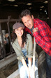 Couple of farmers standing in barn Couple of farmers standing in barn