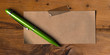 blank memo note and green ballpoint pen