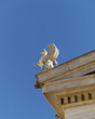 Griffin statue on neoclassical roof, room for type