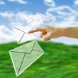 Finger pushing the letter with nature background,