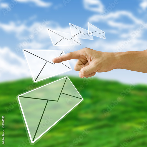 Photo: Finger pushing the letter with nature background, Finger pushing the letter with nature background,