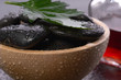 black hot stones in a bowl