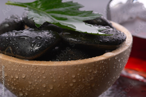 Photo: black hot stones in a bowl black hot stones in a bowl
