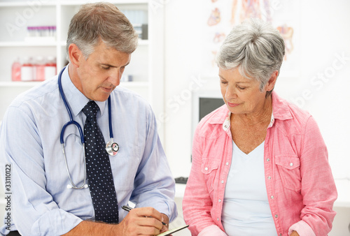 Photo: Doctor with female patient Doctor with female patient