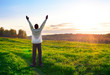 praying man silhouette on sunset background