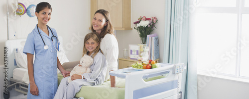 Photo: Nurse in children?s hospital with girl patient and mother Nurse in children?s hospital with girl patient and mother