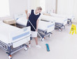 Orderly mopping hospital floor