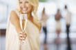 Close up of woman holding champagne flute