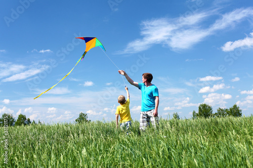Photo: father with son in summer with kite father with son in summer with kite