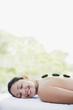 Woman enjoying lastone therapy Woman enjoying lastone therapy