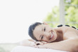 Woman enjoying lastone therapy Woman enjoying lastone therapy