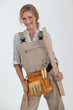 blonde handywoman holding boards