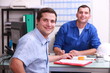 two male colleagues sat in an office two male colleagues sat in an office