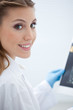 Smiling woman in lab coat