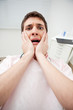 Patient in dentist's office afraid of treatment