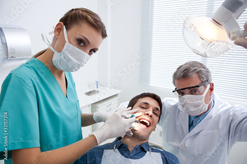 Foto: Patient receiving dental treatment Patient receiving dental treatment