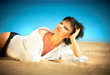 Beautiful young woman relaxing on the beach