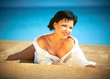 Beautiful young woman relaxing on the beach