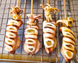 Skewered squid on wooden sticks grilled tentacles Skewered squid on wooden sticks grilled tentacles