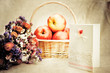 Apples in basket and wild flowers