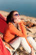 Camping beach woman by campfire in tent Camping beach woman by campfire in tent