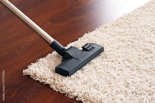 Photo: Modern vacuum cleaner to tidy up the living room. Modern vacuum cleaner to tidy up the living room.