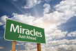 Miracles Green Road Sign Against Clouds Miracles Green Road Sign Against Clouds