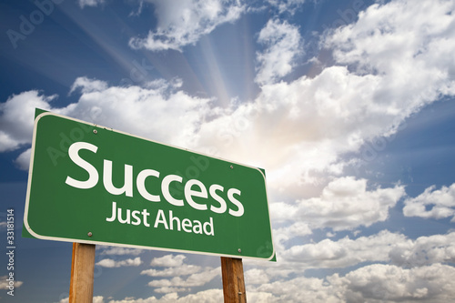 Photo: Success Green Road Sign Against Clouds Success Green Road Sign Against Clouds