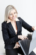 portrait of young businesswoman with folders