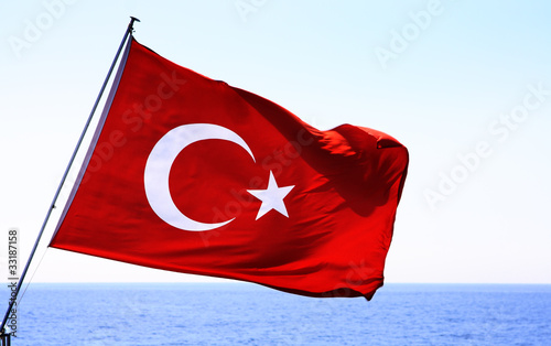 Photo: Image of Turkish flag over sea Image of Turkish flag over sea