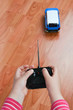 Photo: Child's hands holding a remote control toy car Child's hands holding a remote control toy car