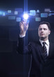 business man pressing a touchscreen button