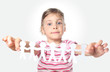little girl holding garland of paper little people