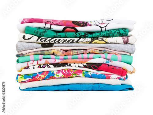 Photo: Stack of colorful clothes isolated on white Stack of colorful clothes isolated on white