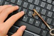 Photo: Hand and rusty antique key Hand and rusty antique key