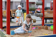 Girl plays in sandbox