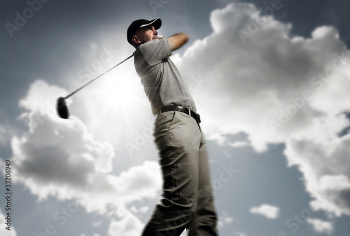 Photo: golfer shooting a golf ball golfer shooting a golf ball