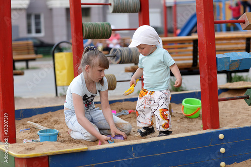 Photo: siblings in sandbox siblings in sandbox