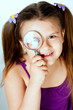 little girl with a magnifying glass